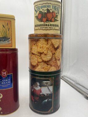 Stacked Decorative Vintage Tin Containers With Snack And Holiday Themes